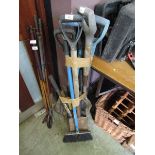 A selection of long handled garden tools to include spades, shovels, etc