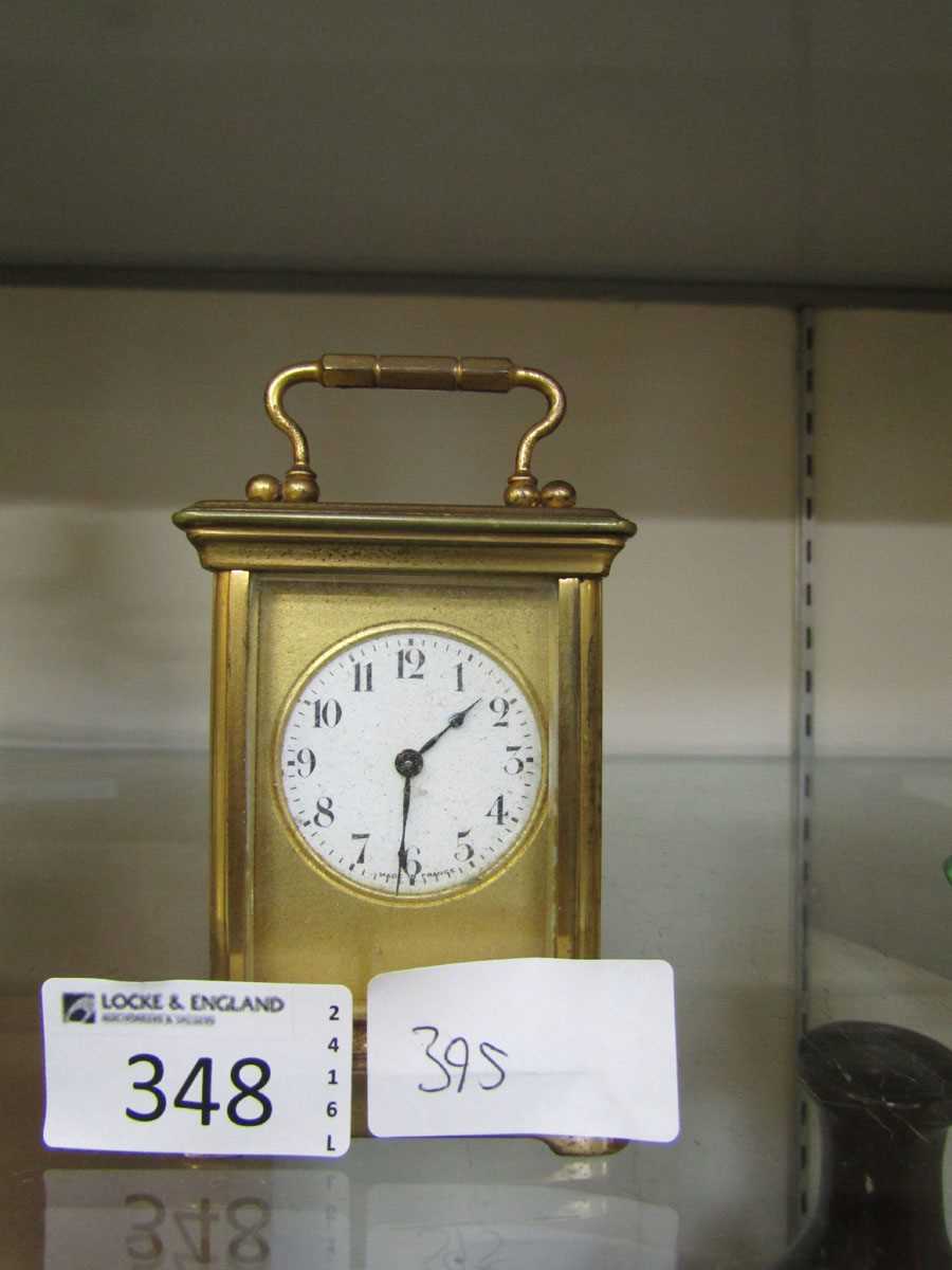 A small scale French brass and five glass carriage clock