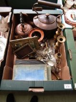 A tray of assorted metalware to include copper kettle, teapot, brass candlesticks, flatware, etc