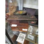 A mahogany work box along with floral decorated Rowntree tin and ebonised floral decorated box