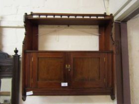 An Edwardian mahogany wall mounted cabinet having two doors