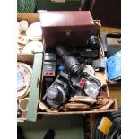 A tray of various cameras and lenses