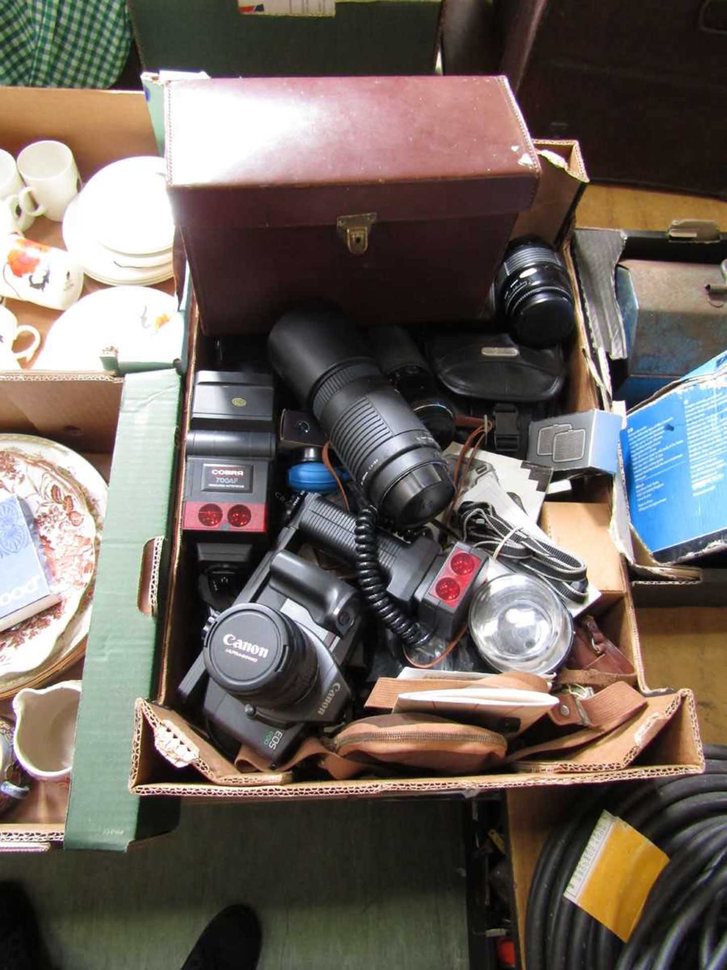 A tray of various cameras and lenses