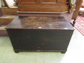 An early 20th century stained pine travelling trunk.