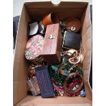 A shoebox containing an assortment of costume jewellery to include beads, bangles, watches, cuff