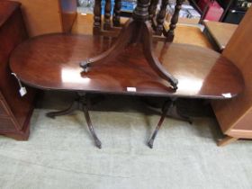 A reproduction mahogany twin pedestal coffee table