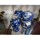 Four oriental style blue and white ginger jars (All but one missing lids) along with a similar