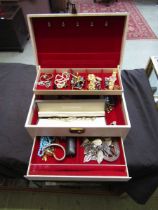 A mid-20th century jewellery box containing a quantity of costume jewellery