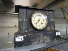 A Victorian black slate mantel clock