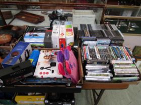 Four trays containing PC disc games, boxed gaming items to include headsets, etc