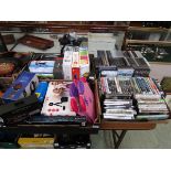 Four trays containing PC disc games, boxed gaming items to include headsets, etc