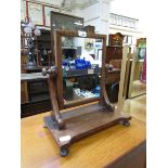 A Victorian mahogany veneered swing toilet mirror