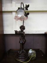 A moulded table lamp in the form of young child playing flute