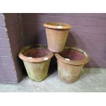 Three terracotta garden pots