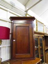 A Georgian mahogany corner wall mounted cupboard