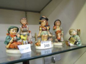 An assortment of six Goebel Hummel figurines of young children