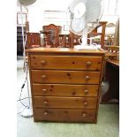 A modern pine chest of five drawers