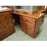 A modern pine dressing table with four drawers