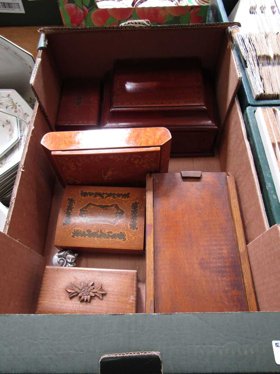 A tray containing wooden boxes