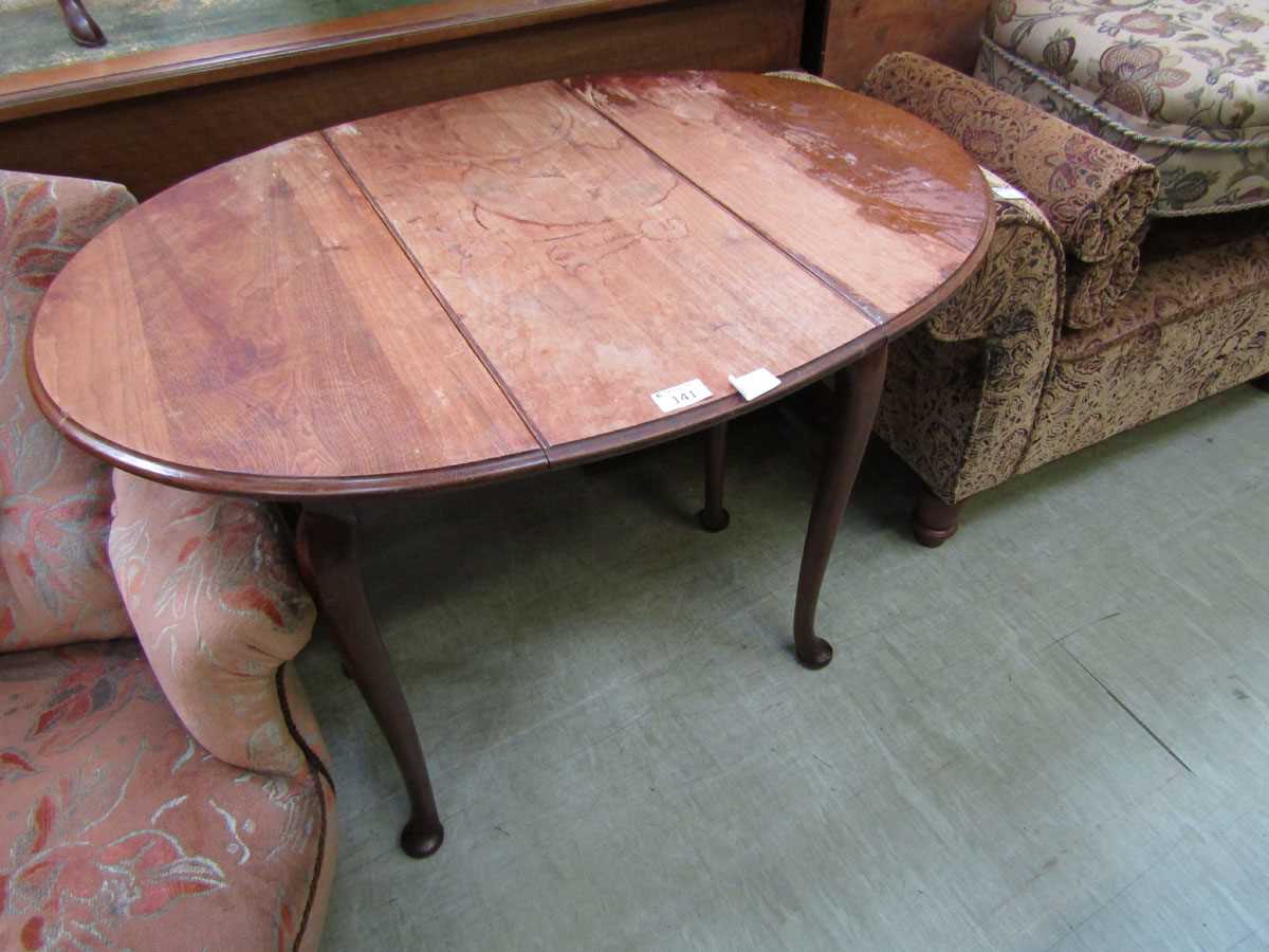 An early 20th century mahogany gate leg table