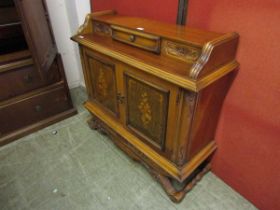 A reproduction continental style sideboard having a raised top section with two cupboard doors