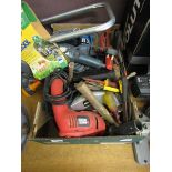 A tray containing a large quantity of hand tools to include electric saw, circular saw, sanders,