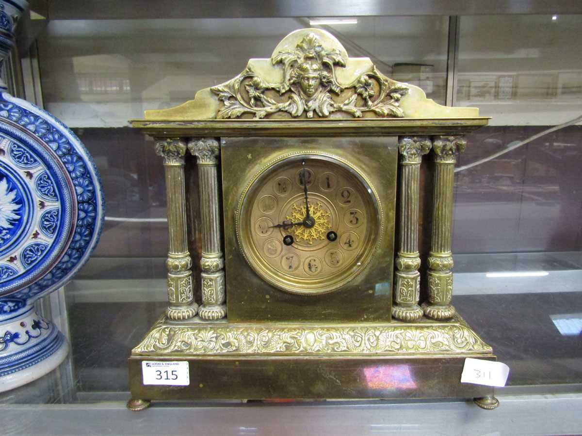 A Victorian style brass cased mantel clock