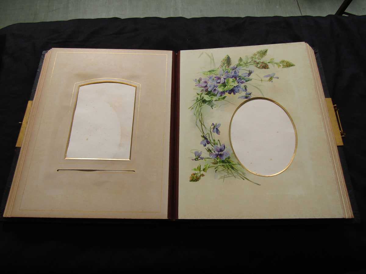 A Victorian black leather bound photo album with floral decoration - Image 2 of 2