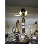 A brass bodied Graham Bell style telephone marked to front Eastbourne 29276