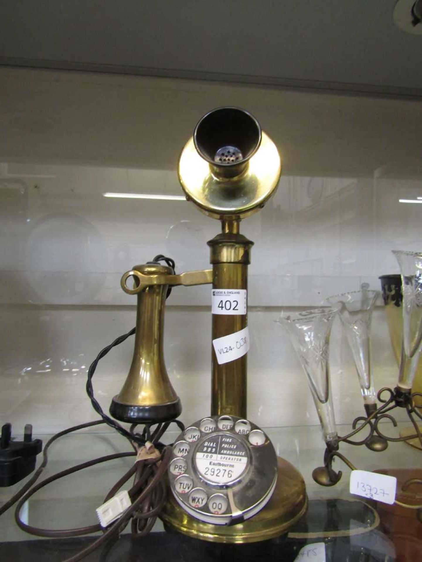 A brass bodied Graham Bell style telephone marked to front Eastbourne 29276