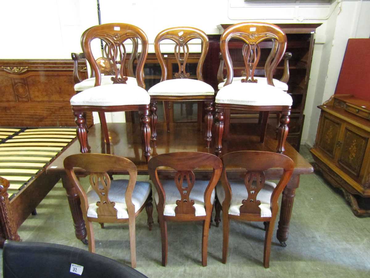 A set of six plus two reproduction Victorian style balloon back dining chairs with overstuffed