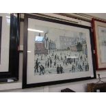 A framed and glazed Lowry print