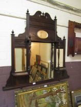 An Edwardian walnut over mantle mirror