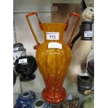 A Murano/Scheider style twin handled tango orange glass vase