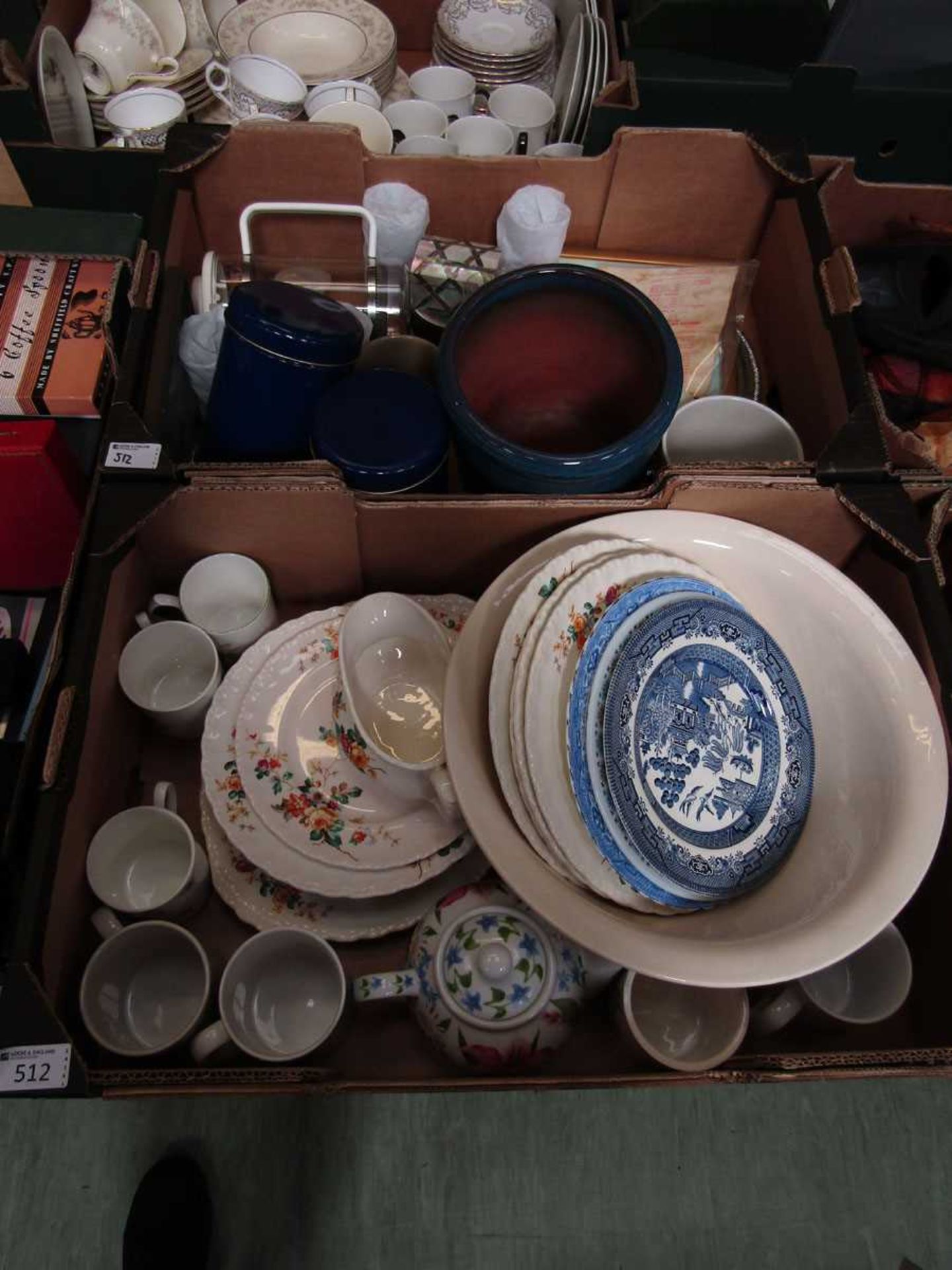 Two trays of ceramic and other ware to include plates, planters, bowls, storage jars, etc