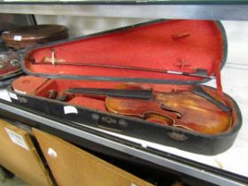 A split back violin and bow in hard carry case (A/F)