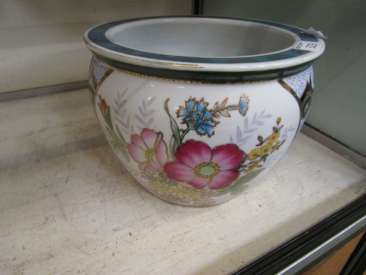 An oriental ceramic planter with floral and blue and white design