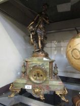 An onyx and gilt metal timepiece with figural group of lady and cherub to top (A/F) bearing plaque