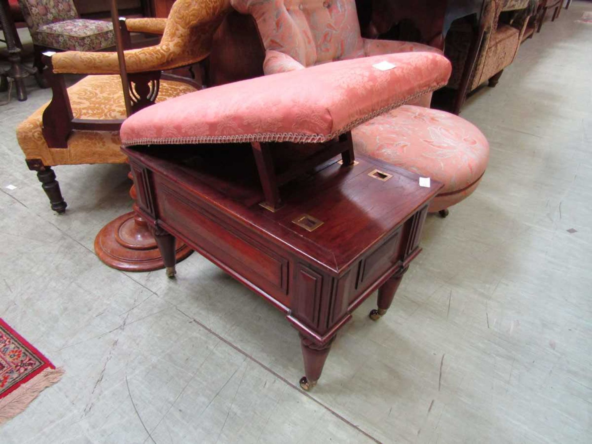 A Victorian mahogany gout stool