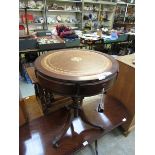 A reproduction mahogany effect drum table