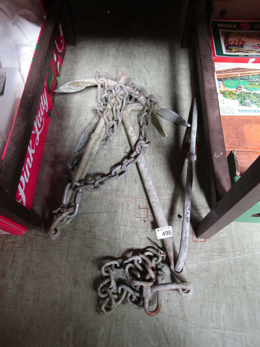 Two metal anchors with chains