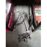 Two metal anchors with chains