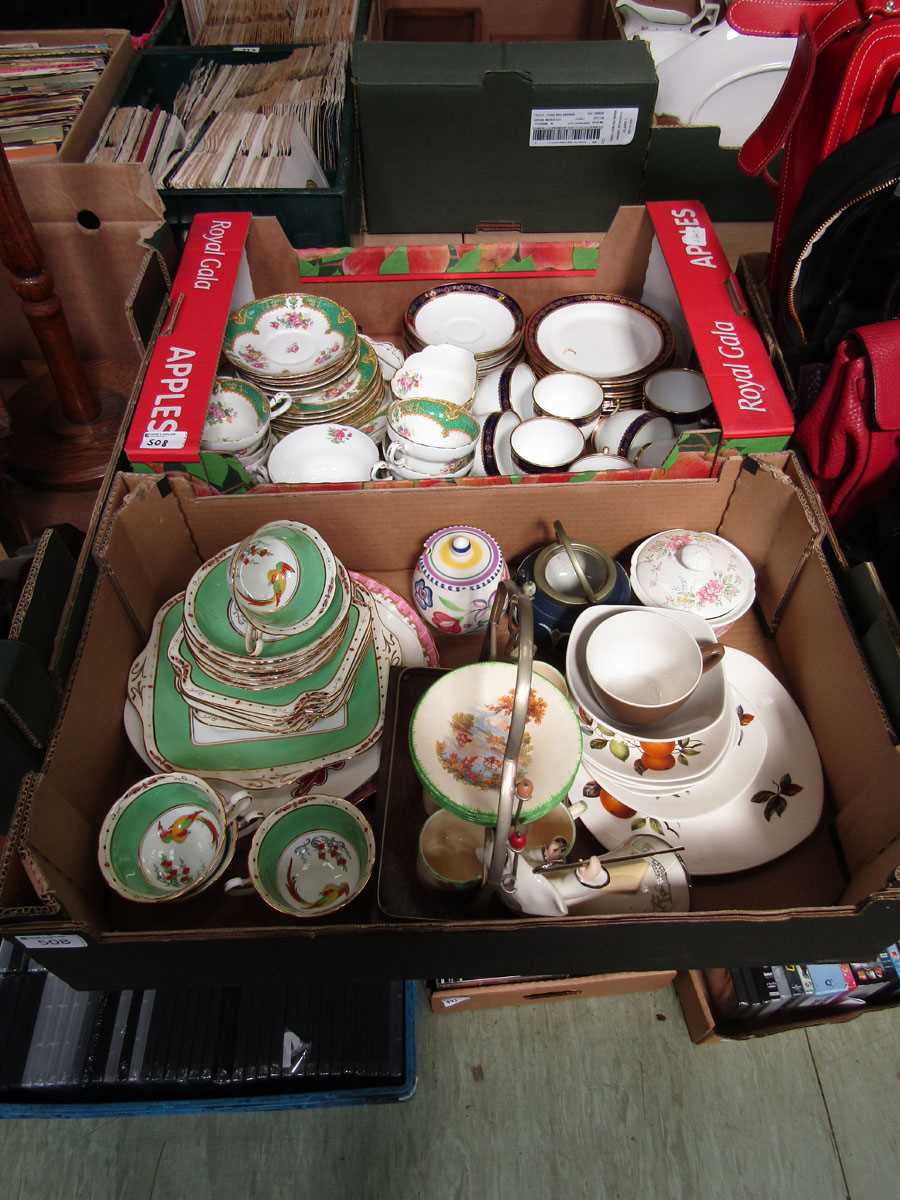 Two trays of ceramic ware to include green decorated cups and saucers, blue and gilt decorated cups,