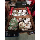 Two trays of ceramic ware to include green decorated cups and saucers, blue and gilt decorated cups,