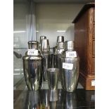 Six cocktail shakers along with a single/double measure