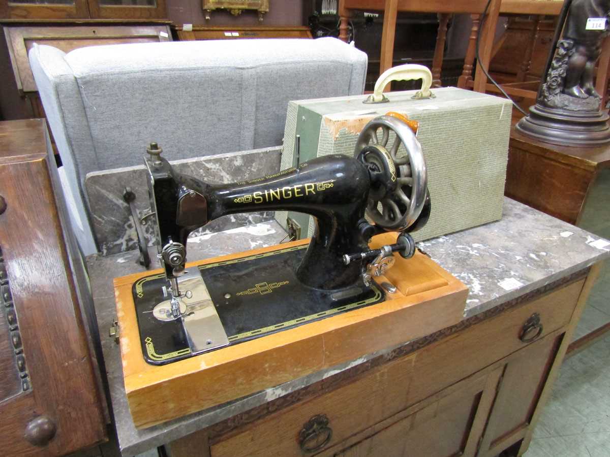 A cased Singer manual sewing machine