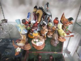 A large assortment of ceramic figurines of birds by various makers