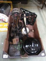 A tray containing menu holder, old sewing machine, cooking pot, etc