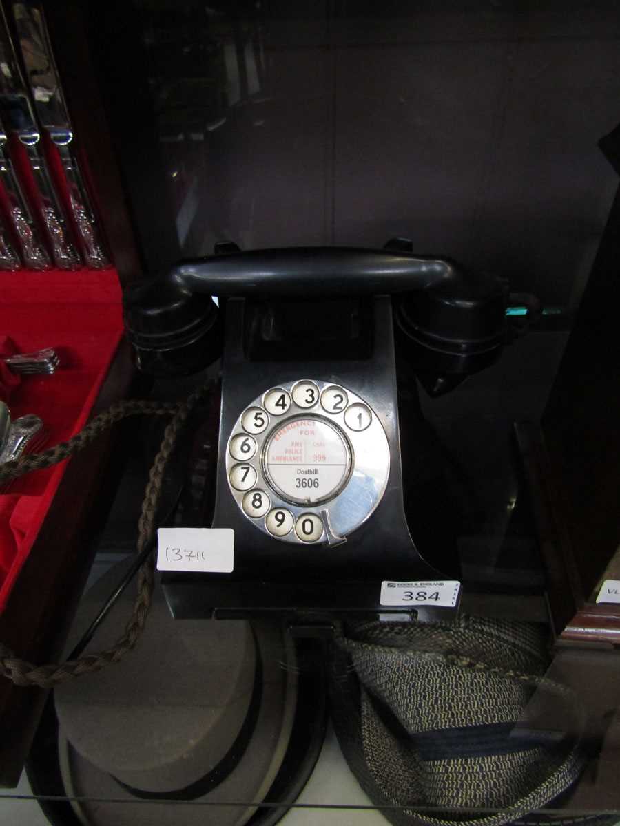 A black Bakelite dial up telephone, front marked for Dosthill 3606