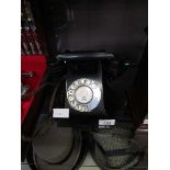 A black Bakelite dial up telephone, front marked for Dosthill 3606